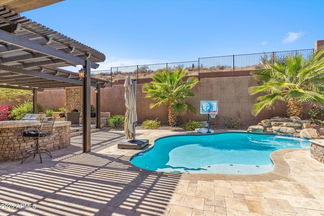 view of swimming pool featuring a patio, a fenced backyard, outdoor dry bar, and a pergola