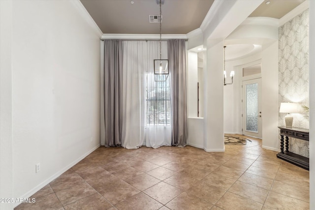 entryway featuring tile patterned flooring, visible vents, crown molding, and baseboards