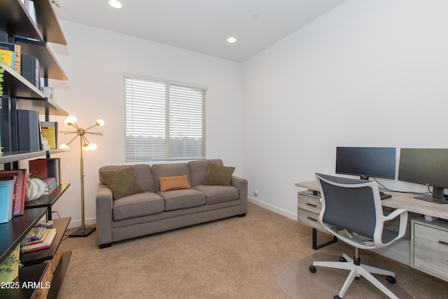 carpeted office featuring a notable chandelier