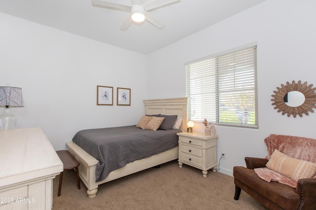 bedroom with ceiling fan and light carpet