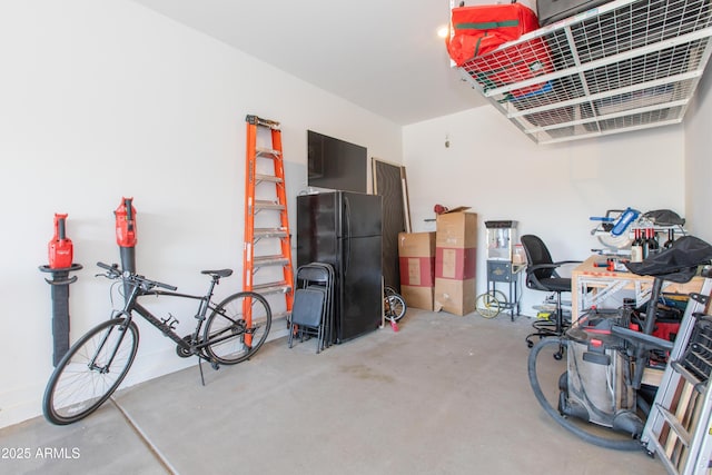 garage featuring black refrigerator