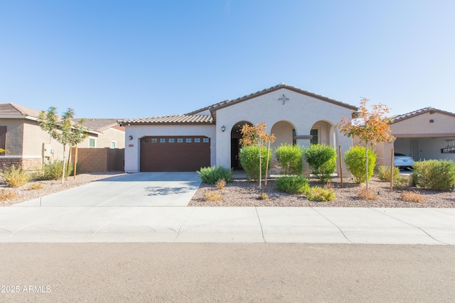 mediterranean / spanish house featuring a garage