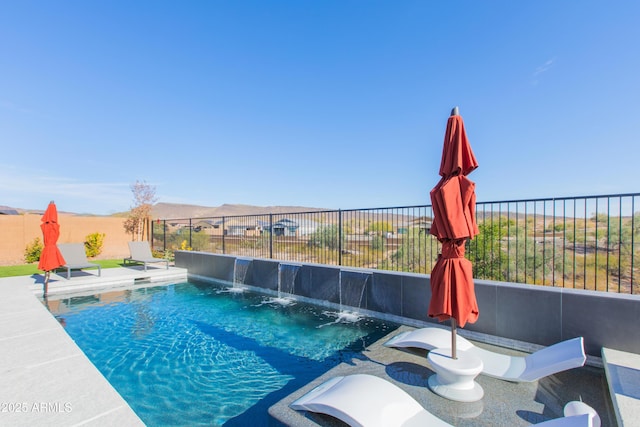 view of swimming pool with pool water feature