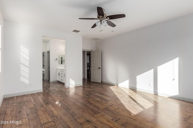 interior space with ceiling fan and dark hardwood / wood-style flooring