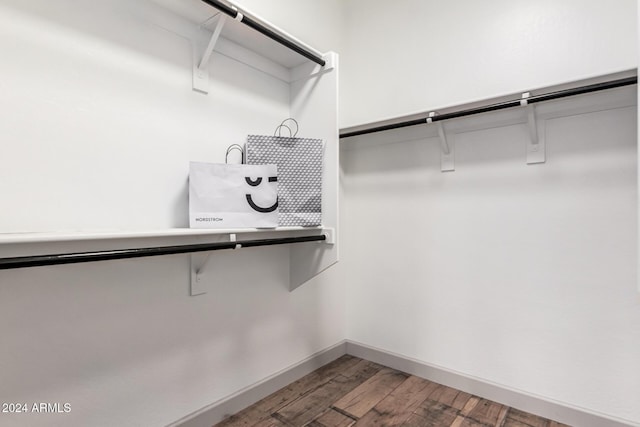 spacious closet featuring hardwood / wood-style flooring