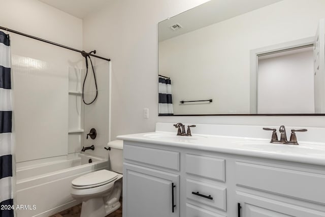 full bathroom with shower / tub combo, vanity, and toilet