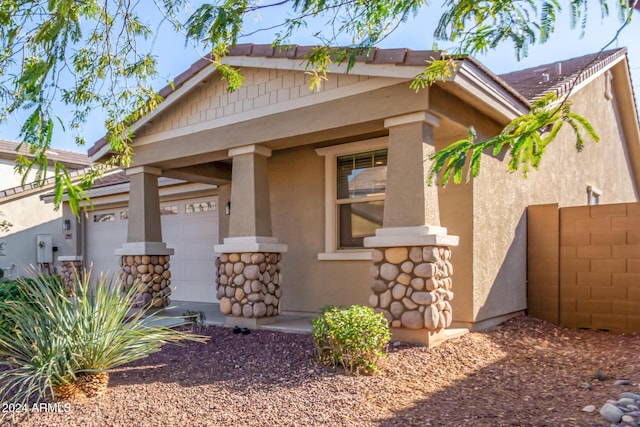 craftsman inspired home with a porch and a garage