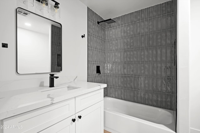 bathroom featuring bathtub / shower combination and vanity