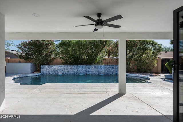 view of swimming pool with a patio area, a fenced backyard, a ceiling fan, and a fenced in pool