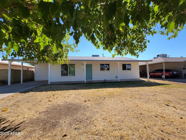 ranch-style home with a carport