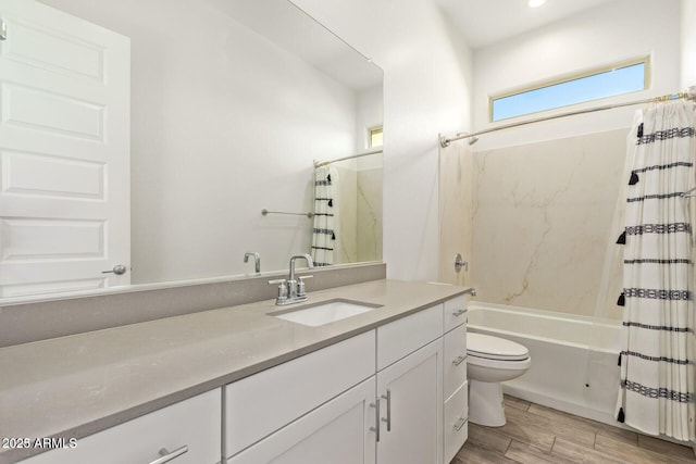 full bath with toilet, shower / tub combo, wood finished floors, and vanity