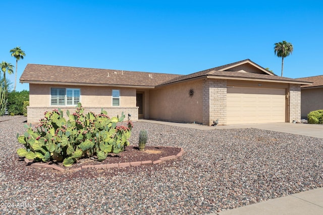 ranch-style home featuring a garage