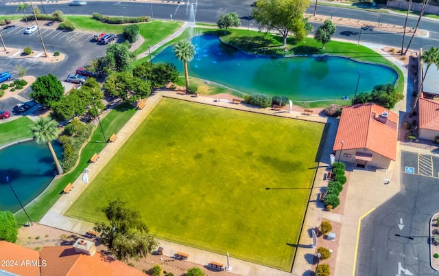 birds eye view of property with a water view