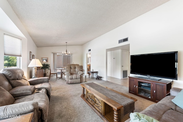 living room with a notable chandelier, a textured ceiling, light colored carpet, and lofted ceiling