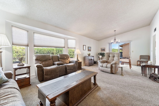 carpeted living room featuring a chandelier, vaulted ceiling, and a wealth of natural light