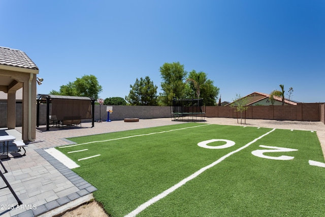 18575 W Vogel Ave, Goodyear, AZ 85338 - view of home's community with a trampoline and a patio