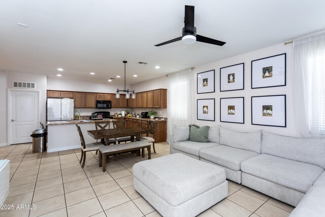 18575 W Vogel Ave, Goodyear, AZ 85338 - living area featuring light tile patterned floors, recessed lighting, and ceiling fan