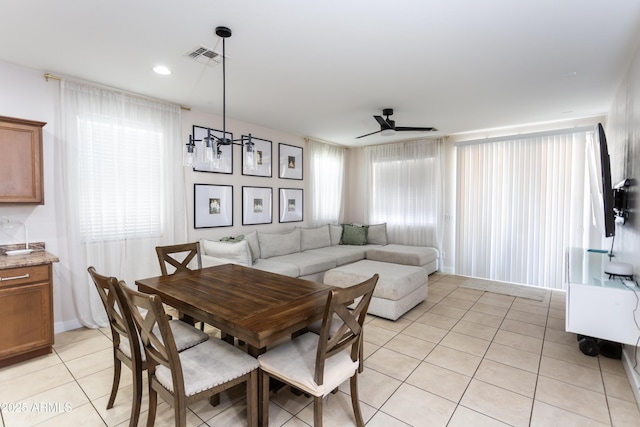 18575 W Vogel Ave, Goodyear, AZ 85338 - dining room featuring light tile patterned floors, ceiling fan, and plenty of natural light
