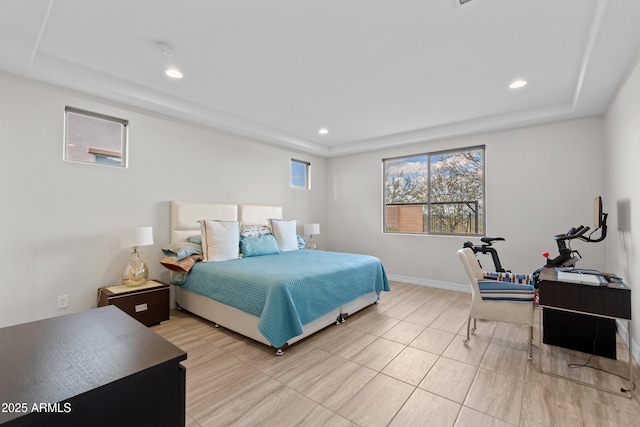 bedroom with baseboards, a raised ceiling, and recessed lighting