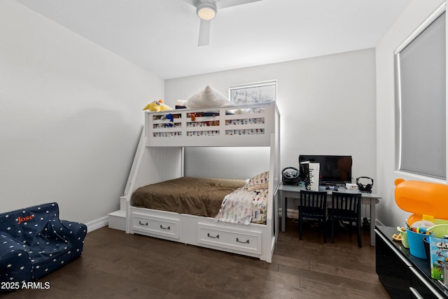 bedroom featuring ceiling fan, baseboards, and wood finished floors