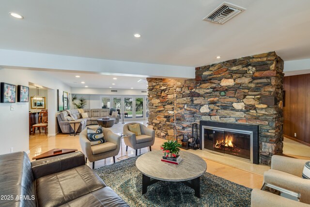 345 W Gardenia Dr, Phoenix, AZ 85021 - living area featuring recessed lighting, a stone fireplace, and visible vents