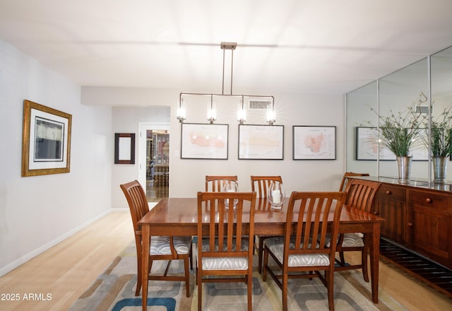 345 W Gardenia Dr, Phoenix, AZ 85021 - dining area featuring light wood finished floors and baseboards