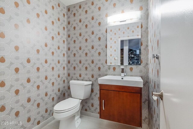 345 W Gardenia Dr, Phoenix, AZ 85021 - half bathroom with baseboards, wallpapered walls, toilet, and vanity