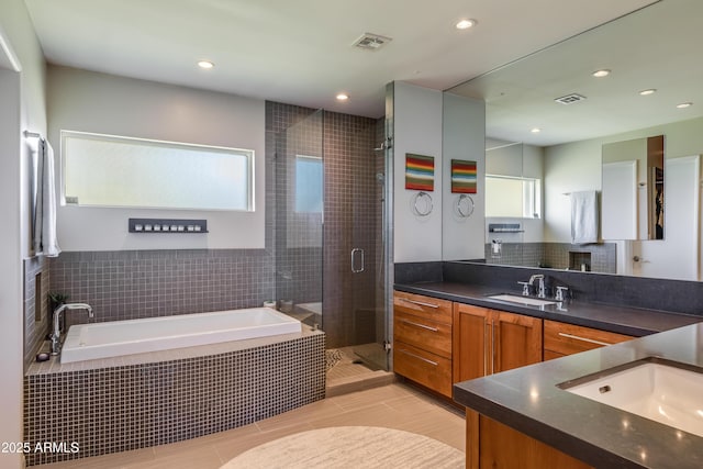 345 W Gardenia Dr, Phoenix, AZ 85021 - bathroom featuring a stall shower, plenty of natural light, vanity, and a garden tub