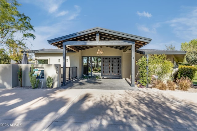 345 W Gardenia Dr, Phoenix, AZ 85021 - exterior space with stucco siding, fence, french doors, driveway, and a gate