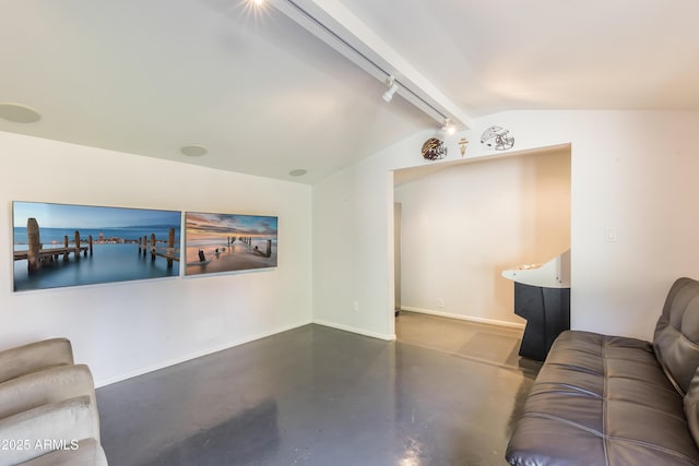 345 W Gardenia Dr, Phoenix, AZ 85021 - living room featuring finished concrete flooring, vaulted ceiling with beams, and baseboards