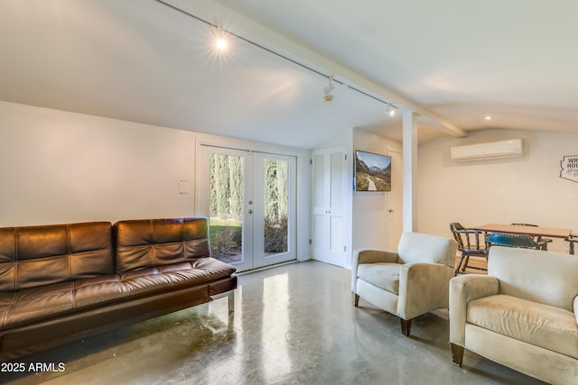 345 W Gardenia Dr, Phoenix, AZ 85021 - living area with a wall mounted AC, finished concrete flooring, rail lighting, lofted ceiling, and french doors