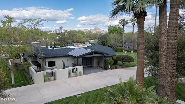 345 W Gardenia Dr, Phoenix, AZ 85021 - view of front of home featuring concrete driveway, stucco siding, roof with shingles, central AC unit, and a fenced front yard