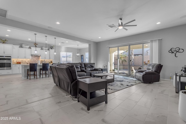 22837 E Silver Creek Ln, Queen Creek, AZ 85142 - living room featuring marble finish floor, visible vents, and plenty of natural light