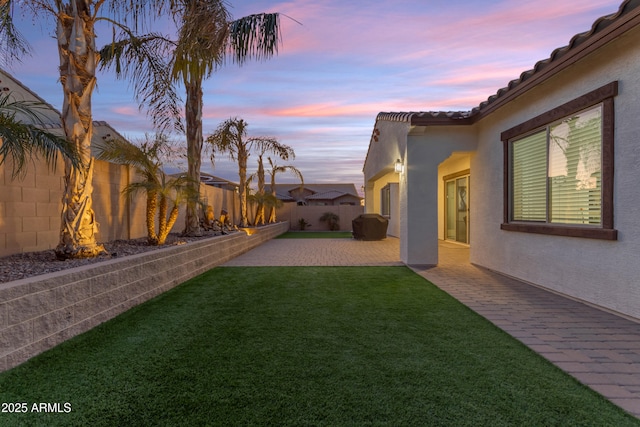 22837 E Silver Creek Ln, Queen Creek, AZ 85142 - yard at dusk with a fenced backyard and a patio