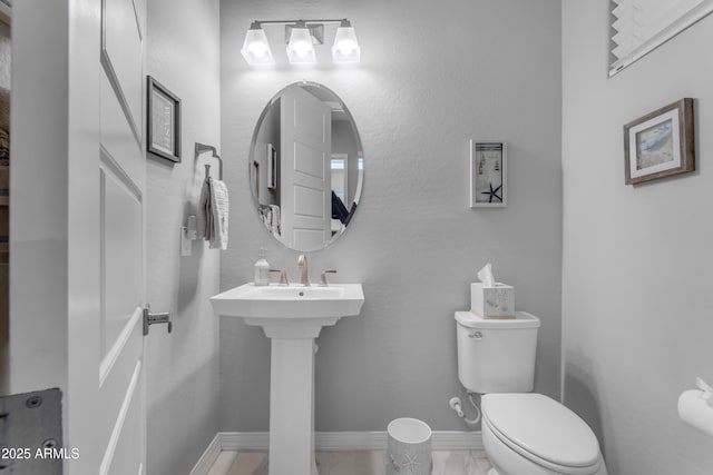 22837 E Silver Creek Ln, Queen Creek, AZ 85142 - half bathroom with toilet, marble finish floor, baseboards, and a sink