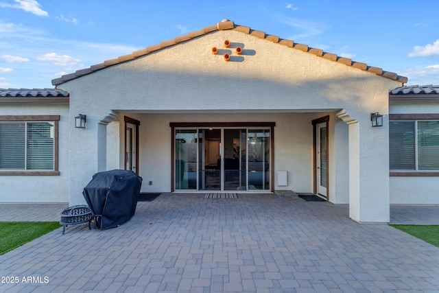 22837 E Silver Creek Ln, Queen Creek, AZ 85142 - rear view of house featuring a patio, a tiled roof, and stucco siding
