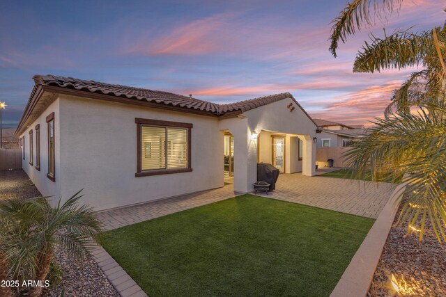 22837 E Silver Creek Ln, Queen Creek, AZ 85142 - back of property featuring a yard, a patio, stucco siding, fence, and a tiled roof