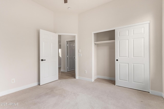 1112 E Winged Foot Dr, Chandler, AZ 85249 - unfurnished bedroom with a closet, baseboards, and light carpet