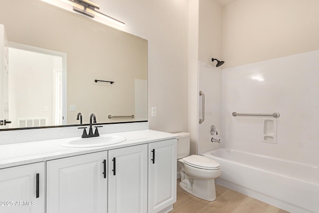 1112 E Winged Foot Dr, Chandler, AZ 85249 - bathroom with visible vents, toilet, wood finished floors, vanity, and bathing tub / shower combination