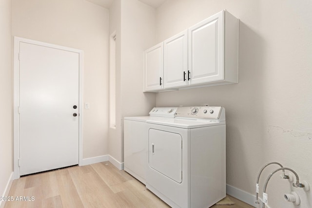 1112 E Winged Foot Dr, Chandler, AZ 85249 - laundry area with baseboards, washing machine and dryer, light wood-style flooring, and cabinet space