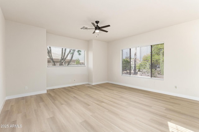 1112 E Winged Foot Dr, Chandler, AZ 85249 - spare room featuring baseboards, light wood finished floors, ceiling fan, and plenty of natural light