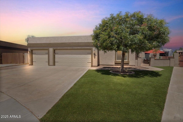 1670 E Whitten St, Chandler, AZ 85225 - view of front of home with concrete driveway, an attached garage, and stucco siding