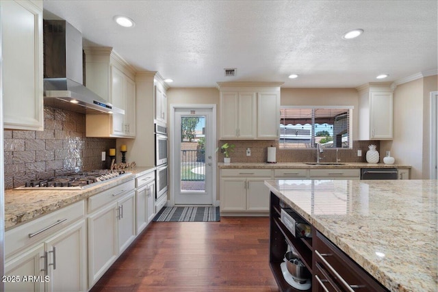 1670 E Whitten St, Chandler, AZ 85225 - kitchen with wall chimney range hood, appliances with stainless steel finishes, a sink, plenty of natural light, and recessed lighting