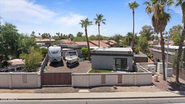 1670 E Whitten St, Chandler, AZ 85225 - view of front of house with a fenced front yard, a residential view, a gate, and stucco siding