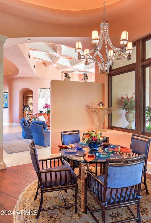 dining area with a chandelier and hardwood / wood-style floors