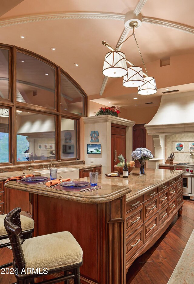 9808 E Honey Mesquite Dr, Scottsdale, AZ 85262 - kitchen featuring double oven range, light stone countertops, dark wood-style flooring, decorative backsplash, and recessed lighting