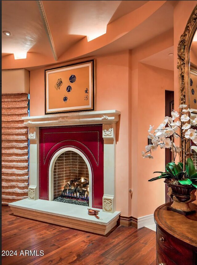 9808 E Honey Mesquite Dr, Scottsdale, AZ 85262 - detailed view of wood finished floors, a fireplace, and baseboards