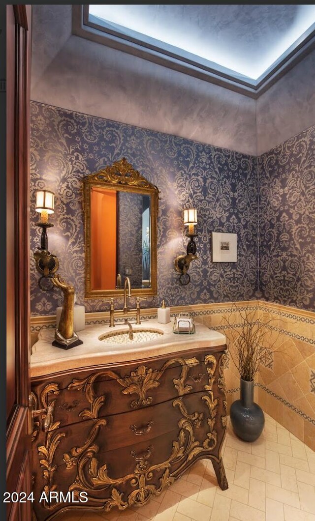 9808 E Honey Mesquite Dr, Scottsdale, AZ 85262 - bathroom with vanity, wallpapered walls, and tile patterned flooring