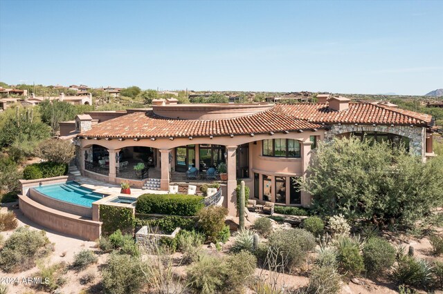 9808 E Honey Mesquite Dr, Scottsdale, AZ 85262 - rear view of property with a tile roof, a patio area, stucco siding, and a pool with connected hot tub