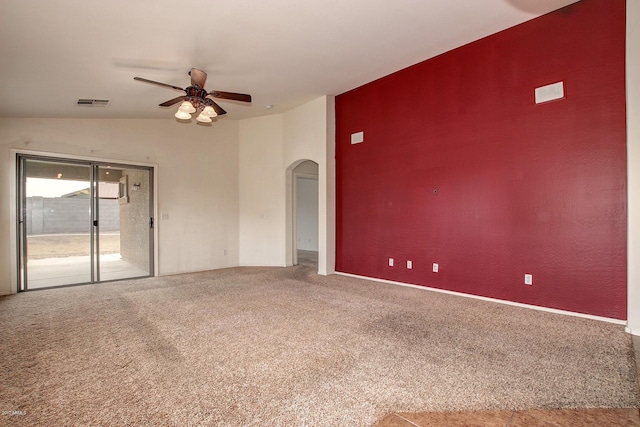 carpeted spare room with vaulted ceiling and ceiling fan